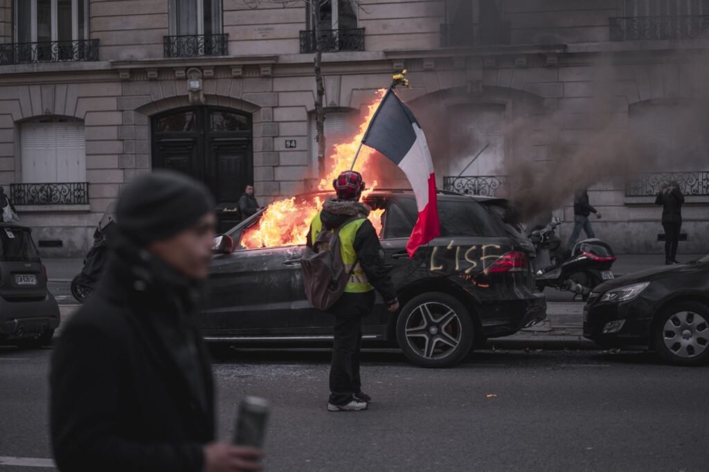 France braces for more unrest after parts of Paris spun out of control